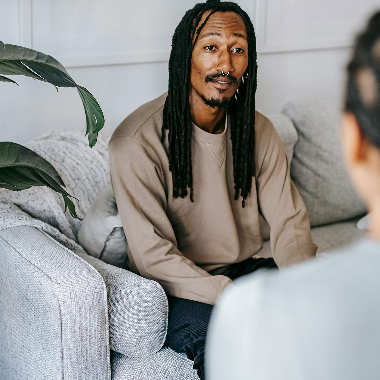 anxiety-Therapy, image of a hopeful person at a therapy session.