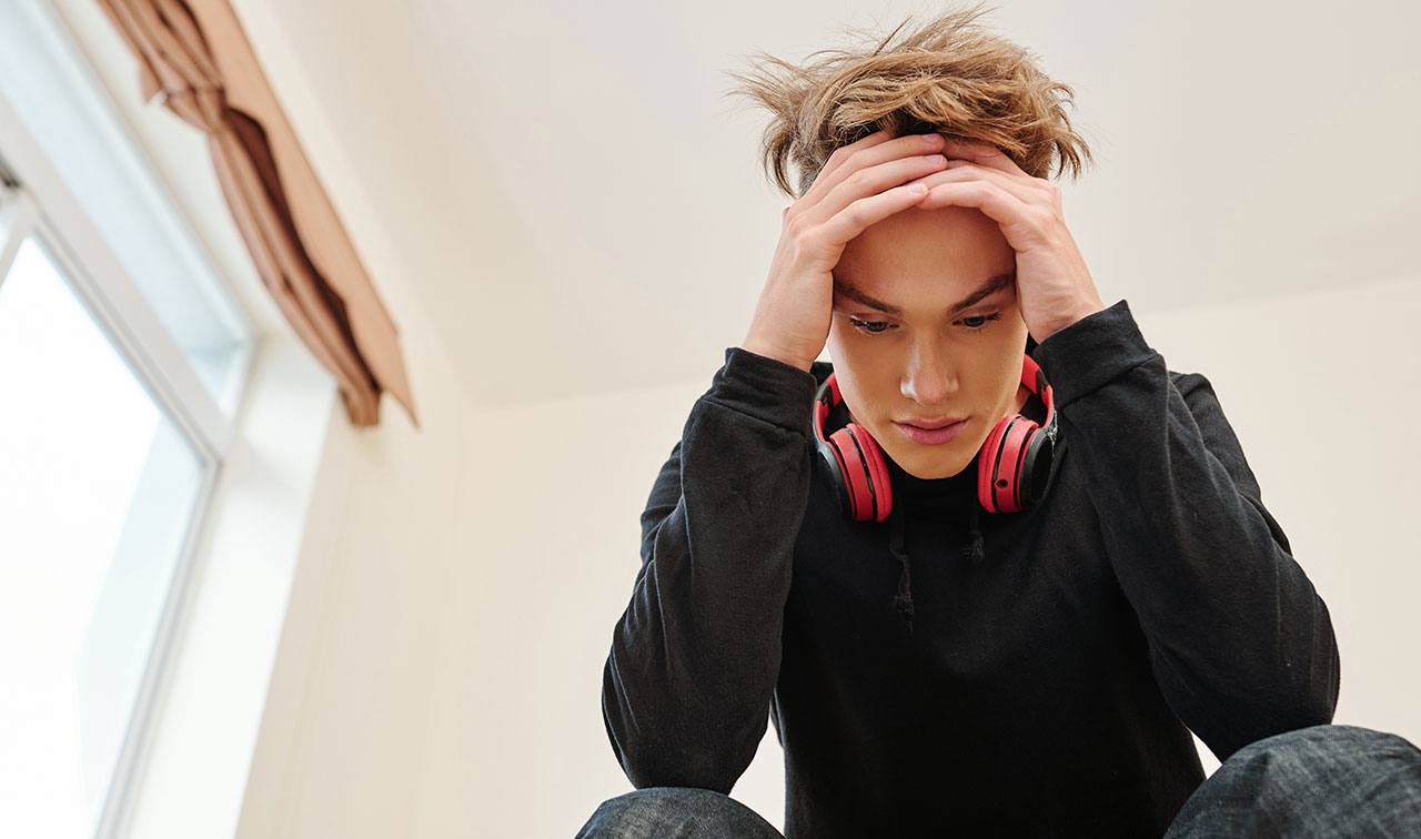 Four (Unexpected) Benefits of ADHD Therapy for Teens and Young Adults in Newport Beach, image of young teen struggling with ADHD