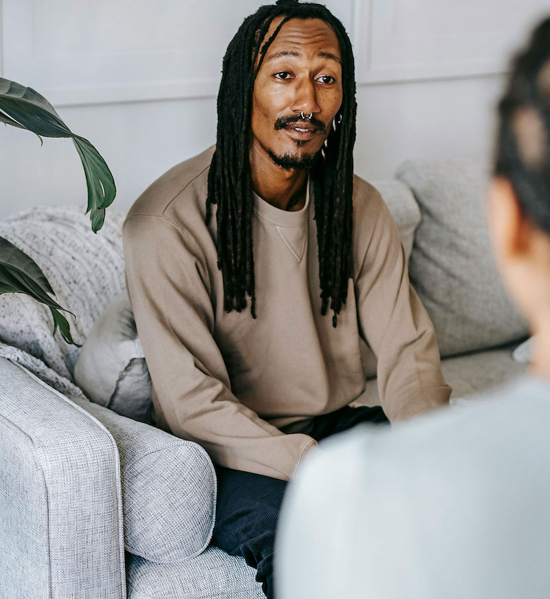 Care concepts therapy man in therapy appointment listening to therapist-min man in therapy appointment listening to therapist