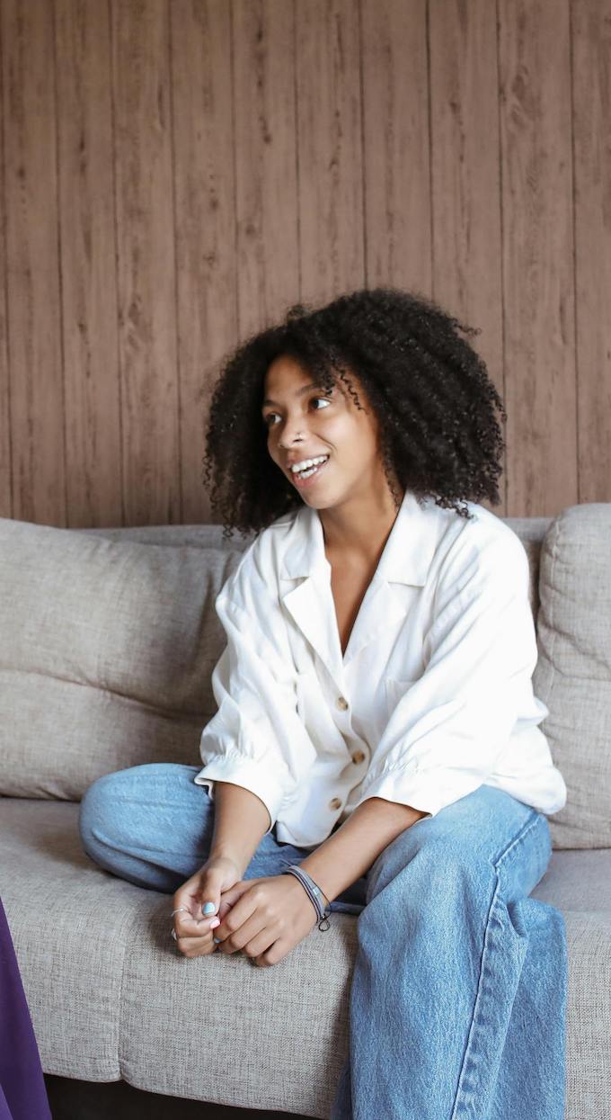 care concepts therapy young woman on sofa talking to therapist-min young woman on sofa talking to therapist