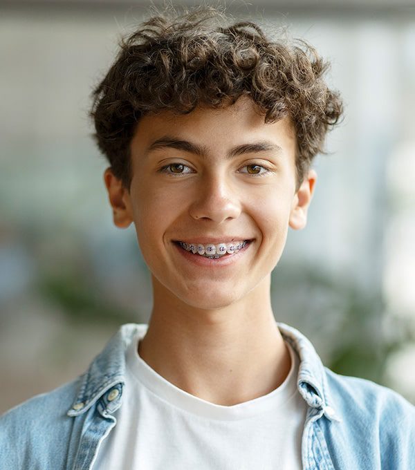 care concepts therapy teen boy smiling at the camera-min teen boy smiling at the camera