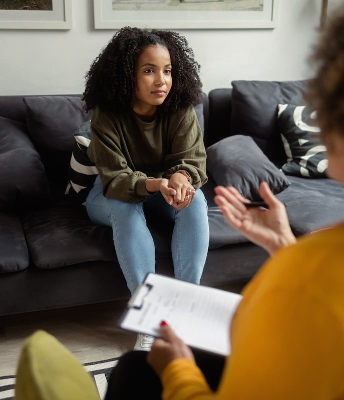 care concepts therapy young woman speaking to therapist-min (1) young woman speaking to therapist