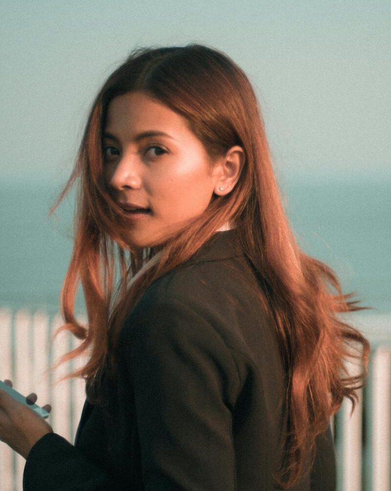 young woman by ocean
