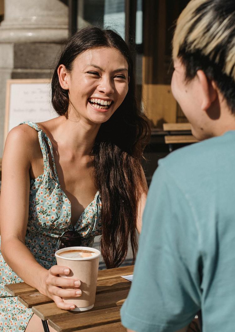 care concepts therapy young woman having coffee with friend laughing-min young woman having coffee with friend laughing