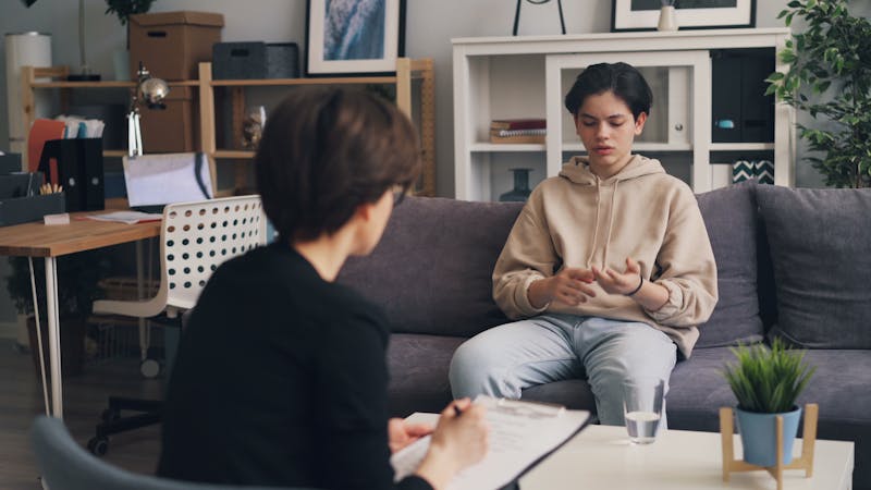 Care Concepts Therapy Teen Boy Talking With Therapist