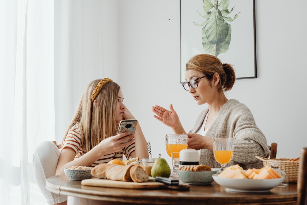 Care Concepts Therapy Mother having a serious conversation with her teenage daughter